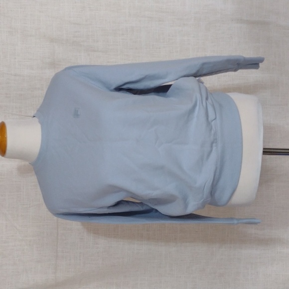 Fila Tops - NWOT Fila baby blue crewneck sweatshirt with pockets!